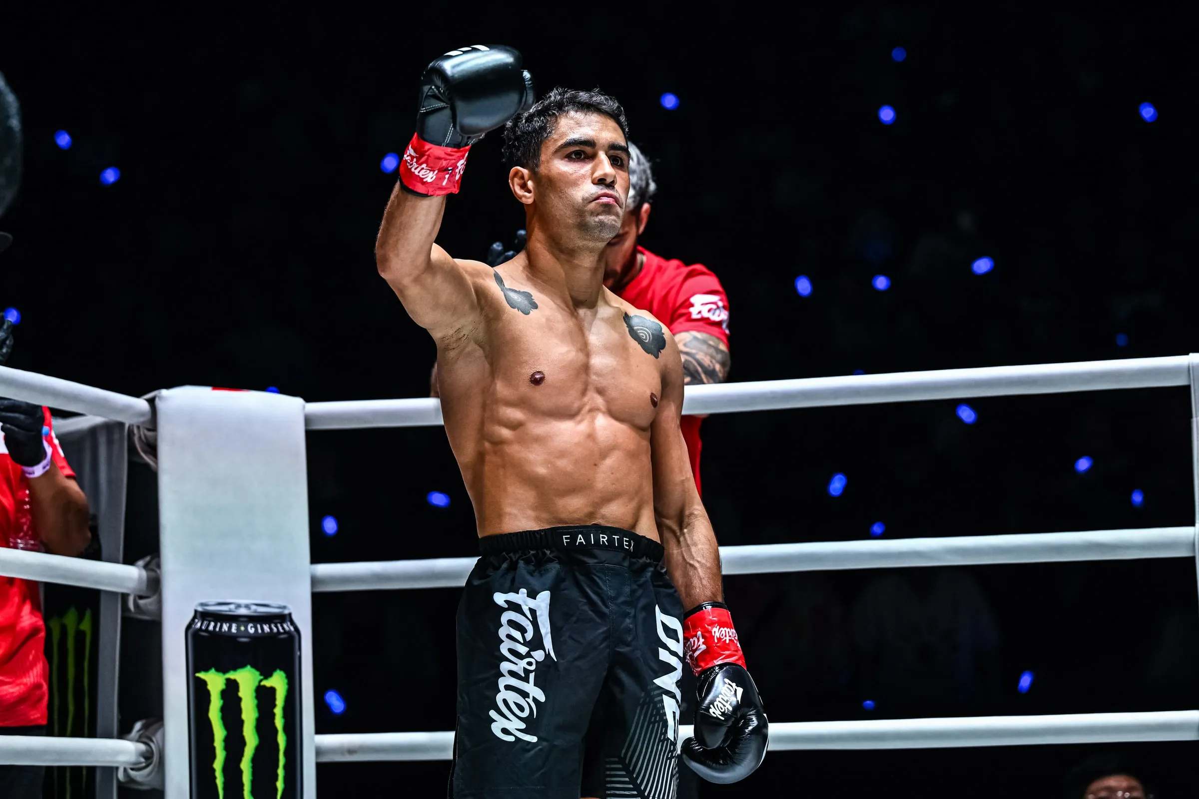 Rui Botelho raising his arms in the corner of the ring