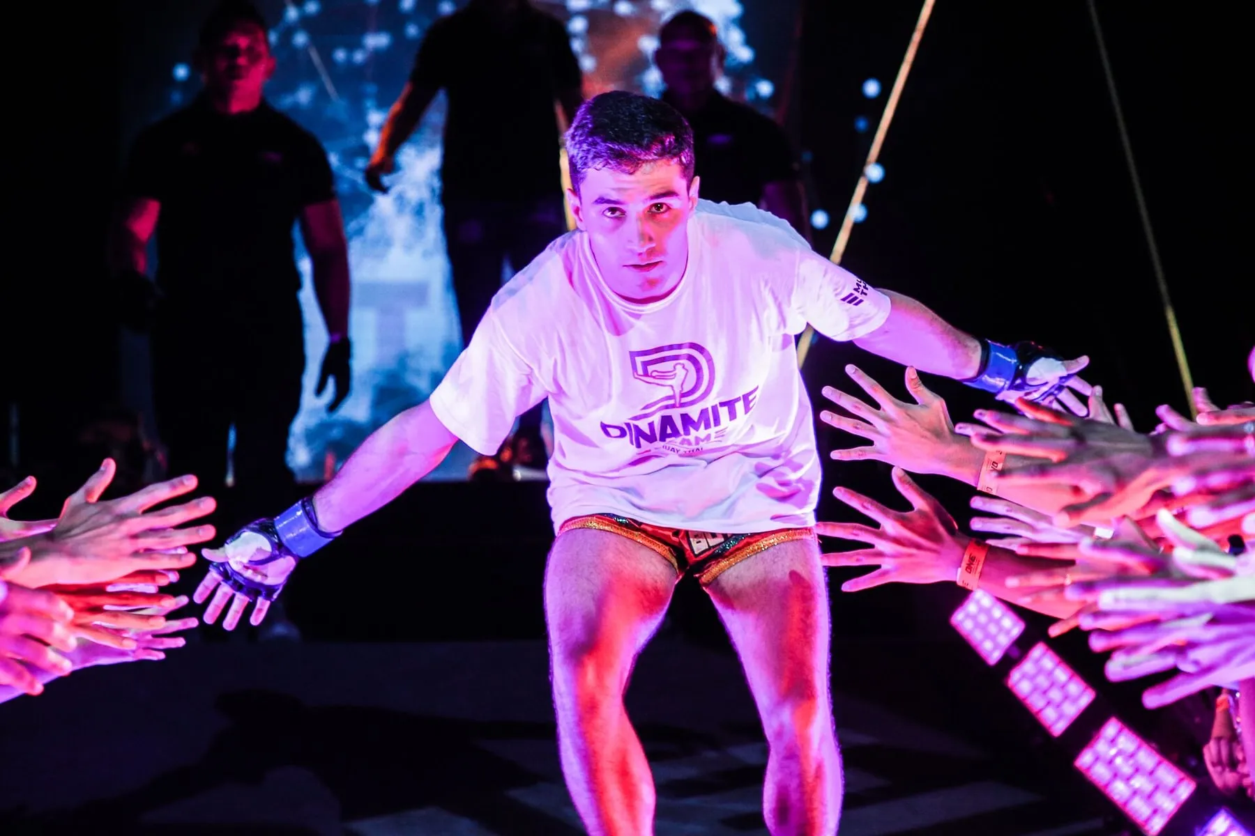 Rui Botelho walking out to the ring through a corridor of fans